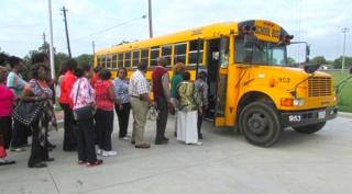 Pinnacle members boarding a bus headed to The Ensemble Theatre